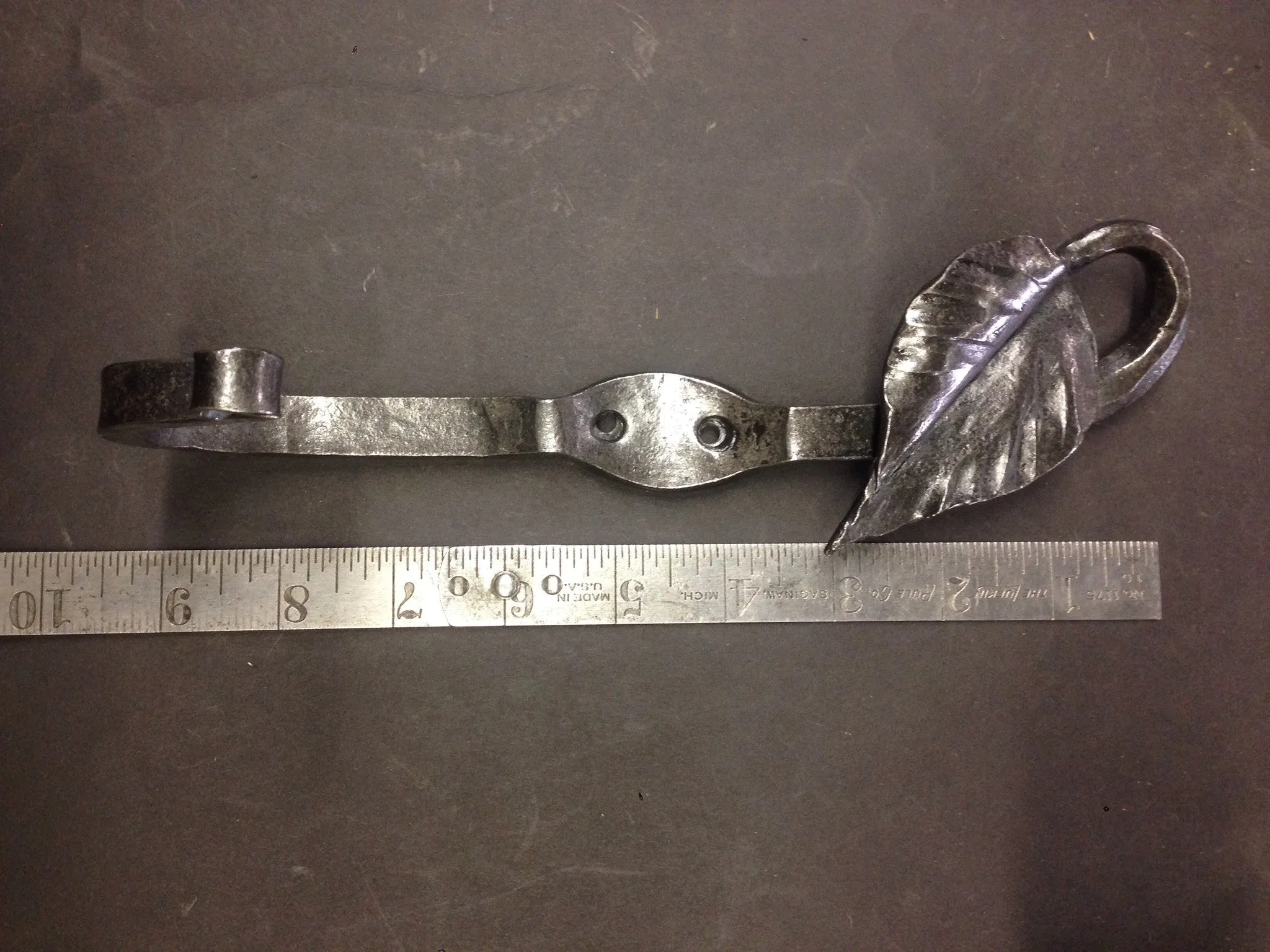 Leaf coat hook.